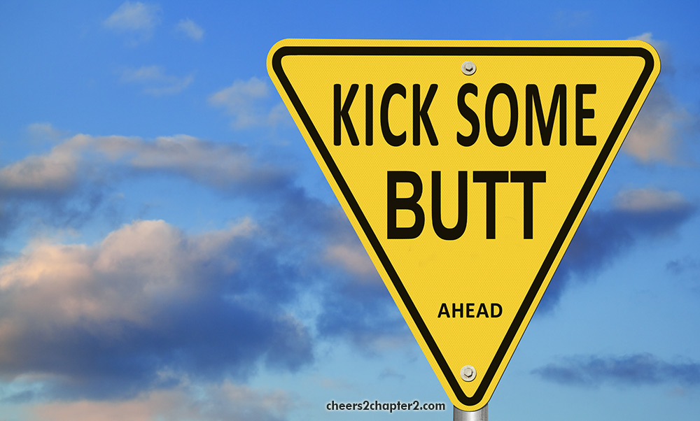 Image of street sign reading kick some butt ahead for positive thinking women over fifty