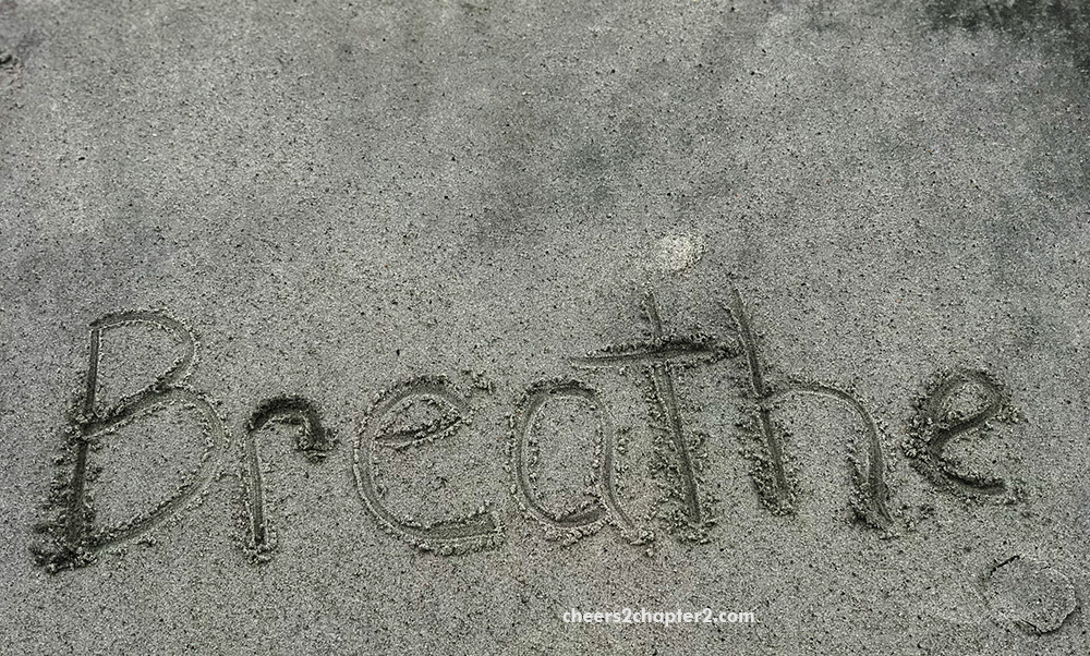 the word breathe written in the sand used for the main image on the the word breathe written in the sand used as the main image for cheers 2 chapter 2 Hearing Your Inner Voice Can Help Ground You to Live a More Positive Life page