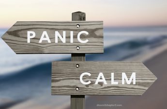 A sign pointing to panic one way and calm the other way - to overcome worry
