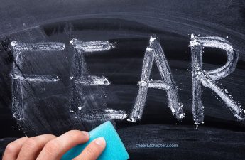 image of chalkboard with the word fear written on it and partially erased
