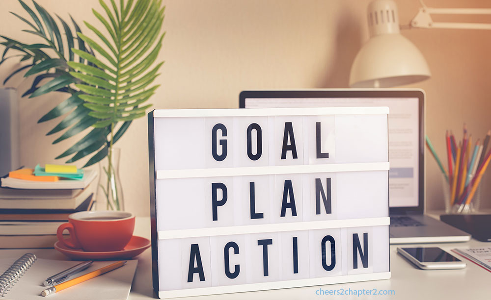 image of sign with goal plan action words for cheers to chapter two How to Reshape Your Life in Chapter Two