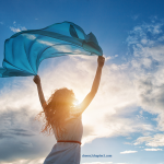 image of woman with arms upraised in the sunshineLearning to let go and move on