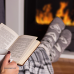 Woman reading and sitting peacefull by a fire Getting through the Holidays with Grace: 5 Tips for Staying Positive Under Stress
